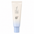 A tube of COSRX Beauty of Joseon Relief Sun Milk Sunscreen on a solid white background. The tube features a white-to-light-blue gradient design with black Korean text and a small red seal.
