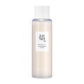 Skincare bottle with a white label on a light beige background