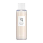 Skincare bottle with a white label on a light beige background