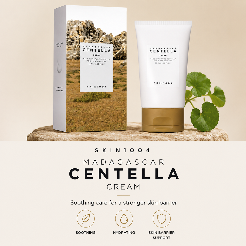 SKIN1004 Madagascar Centella Cream shown with its retail box and squeeze tube on a stone slab, alongside green leaves, with product text and feature icons below on a beige background.